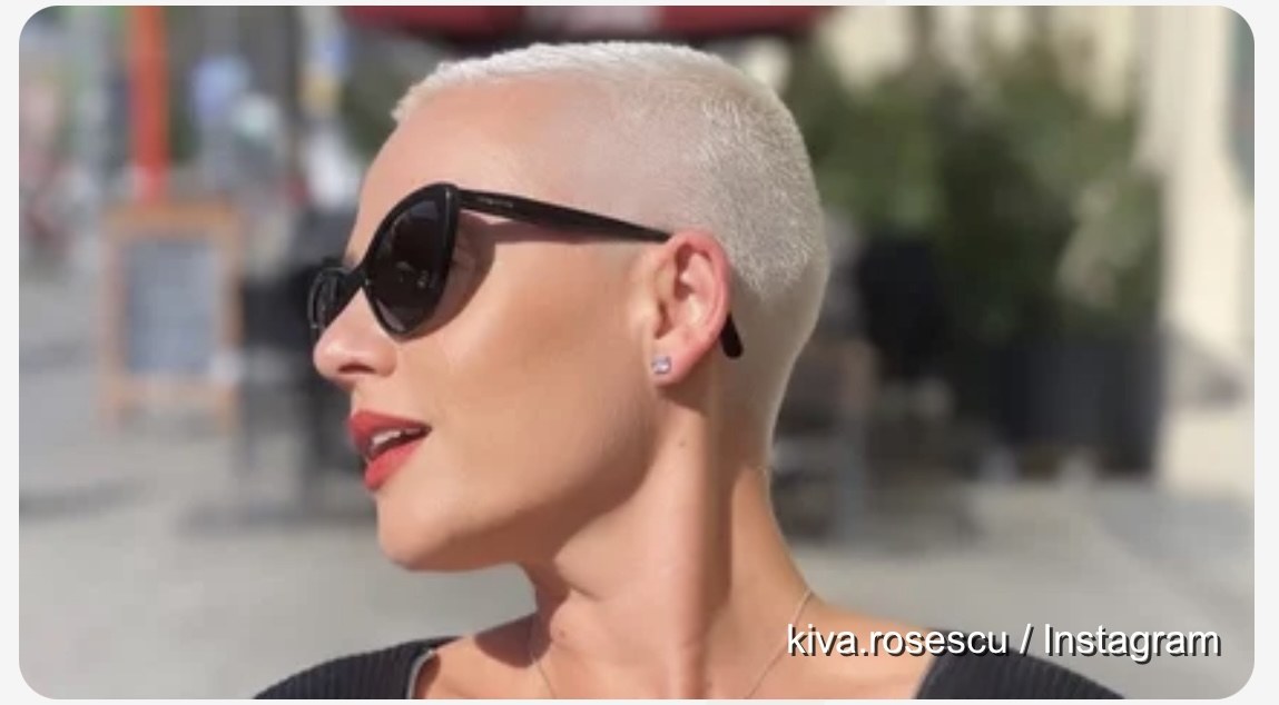 Kiva in black sunglasses with red lipstick